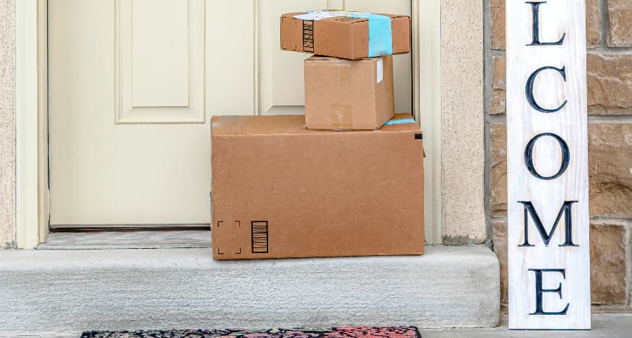 Deliveries on the front porch of a house with a welcome sign in Chicago